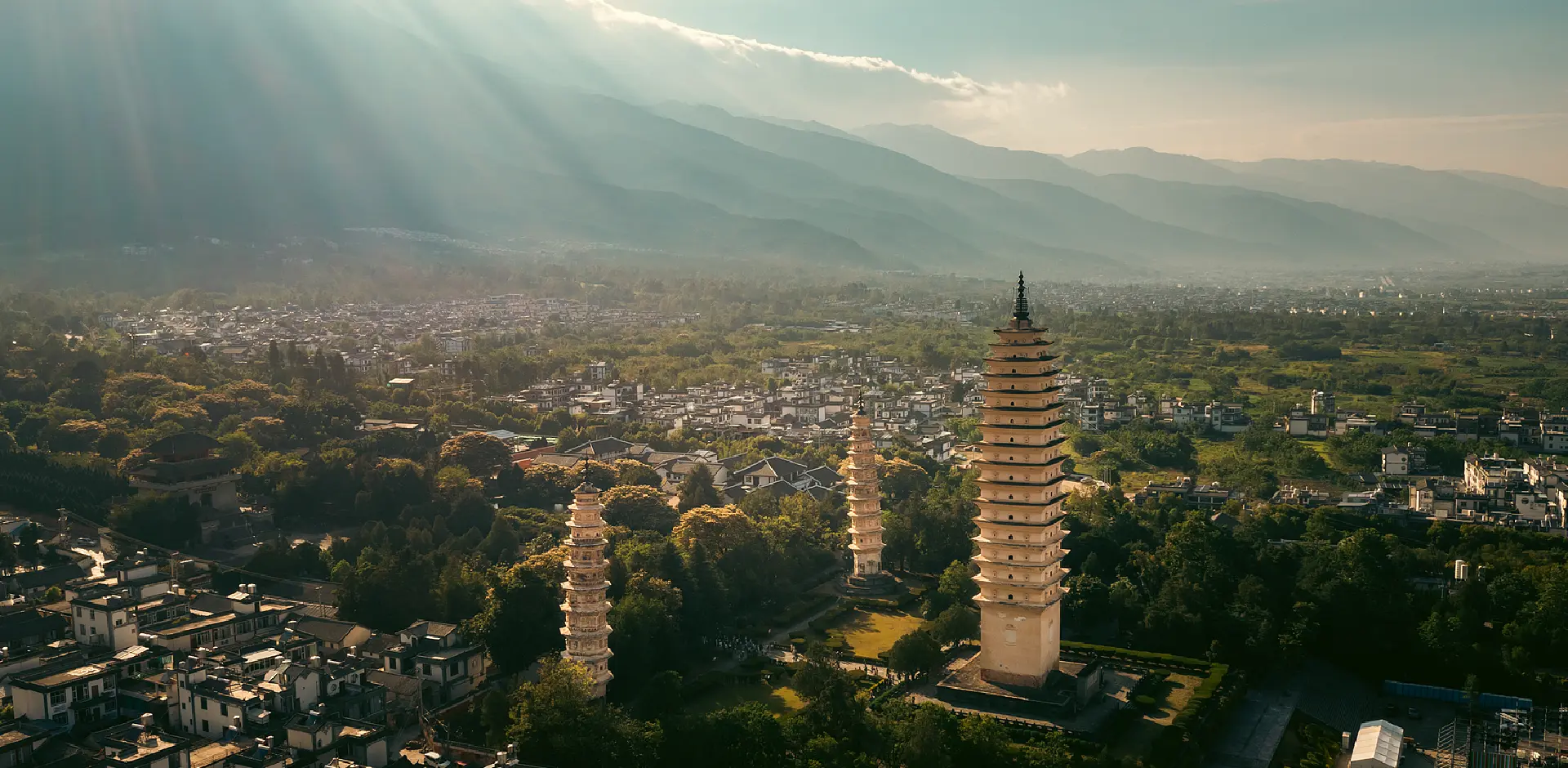 Canger Tea Journey - Dali's Three Pagodas and Cangshan mountains at sunset